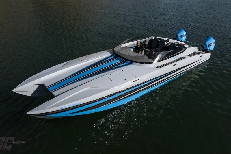 Slide: The Image of 2025 Interceptor 36 GTC powerboat with sleek design and blue accents on the water. - 8