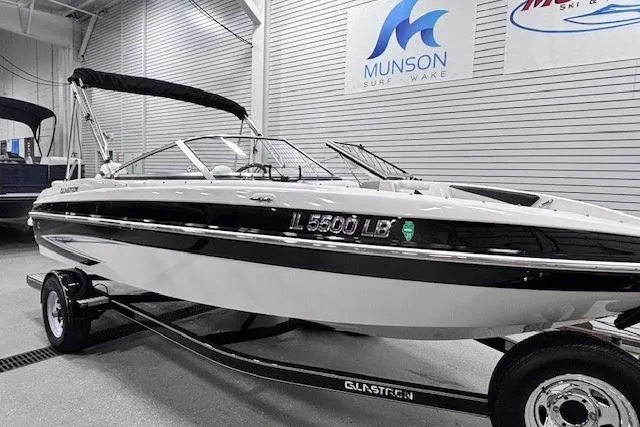 Slide: The Image of 2011 Glastron GT 205 Ski & Fish boat on trailer in showroom. - 11