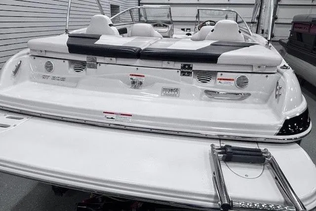 Slide: The Image of 2011 Glastron GT 205 Ski & Fish boat, rear view, showcasing seating and swim platform. - 12