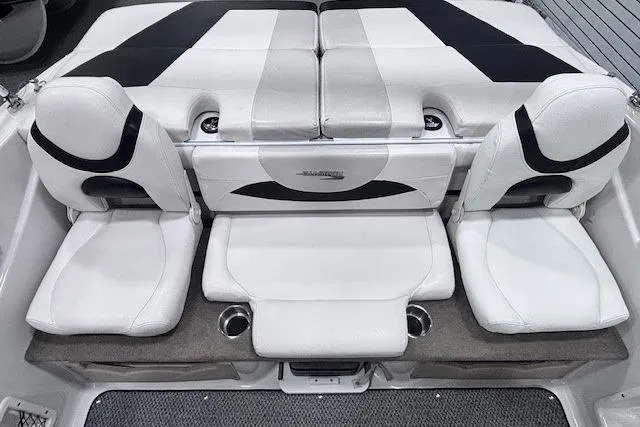 Slide: The Image of 2011 Glastron GT 205 Ski & Fish boat interior with white seating and cup holders. - 15