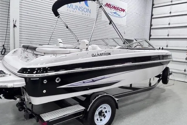 Slide: The Image of 2011 Glastron GT 205 Ski & Fish boat in showroom, black and white design. - 16