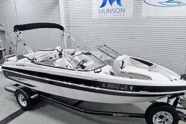 Slide: The Image of 2011 Glastron GT 205 Ski & Fish boat on trailer in showroom. - 17