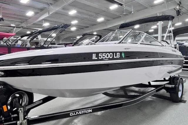 Slide: The Image of 2011 Glastron GT 205 Ski & Fish boat on trailer in showroom. - 18