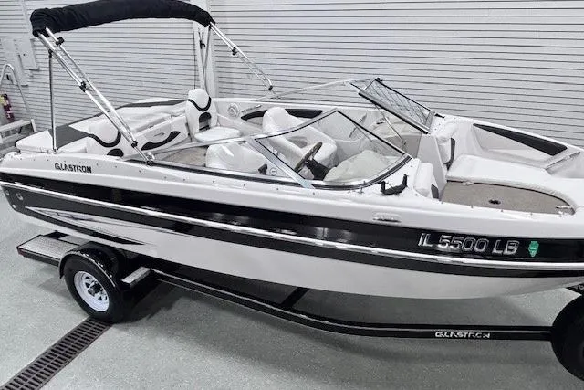 Slide: The Image of 2011 Glastron GT 205 Ski & Fish boat on trailer in indoor storage. - 19