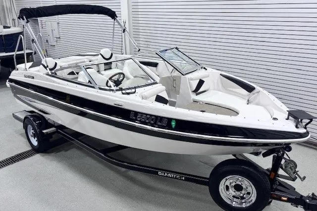 Slide: The Image of 2011 Glastron GT 205 Ski & Fish boat on trailer in showroom. - 2
