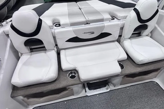 Slide: The Image of 2011 Glastron GT 205 Ski & Fish boat interior with white seating and cup holders. - 25