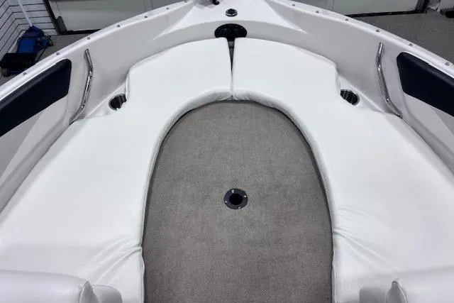 Slide: The Image of 2011 Glastron GT 205 Ski & Fish boat interior with white seating and gray carpet. - 26