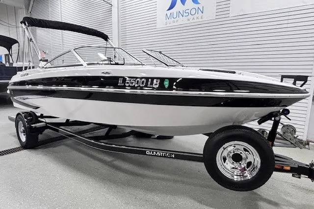 Slide: The Image of 2011 Glastron GT 205 Ski & Fish boat on trailer in showroom. - 3