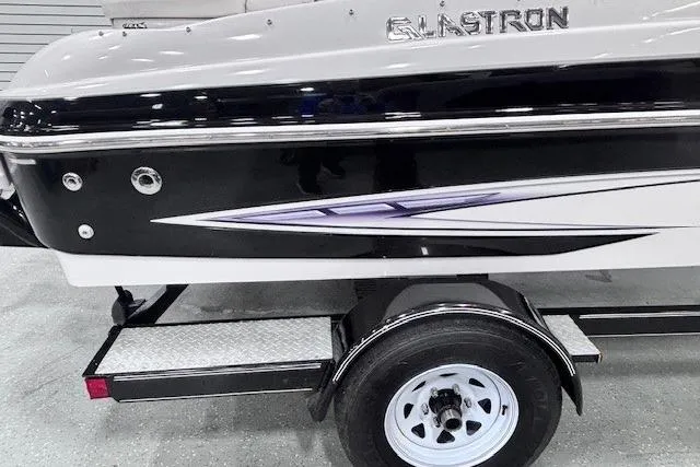 Slide: The Image of 2011 Glastron GT 205 Ski & Fish boat on trailer, black and white design. - 33