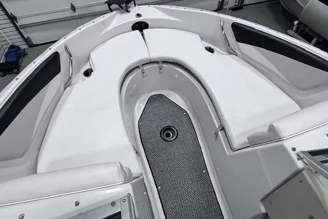 Slide: The Image of 2011 Glastron GT 205 Ski & Fish boat interior with cushioned seating and storage. - 7