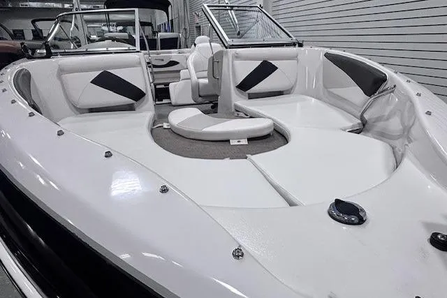 Slide: The Image of 2011 Glastron GT 205 Ski & Fish boat interior with white seating and black accents. - 9