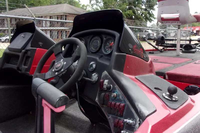 Slide: The Image of 1996 Skeeter ZX200 boat dashboard with steering wheel and control panel. - 12