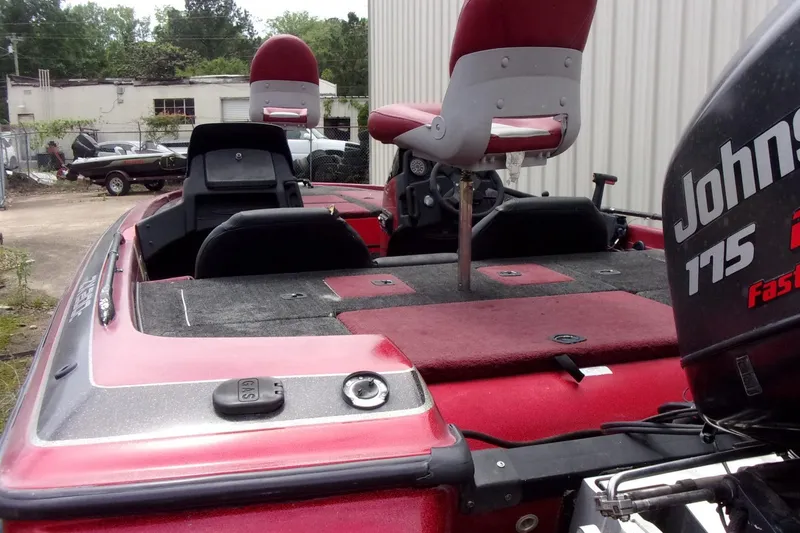 Slide: The Image of 1996 Skeeter ZX200 boat with Johnson 175 motor, featuring red and black seating. - 15