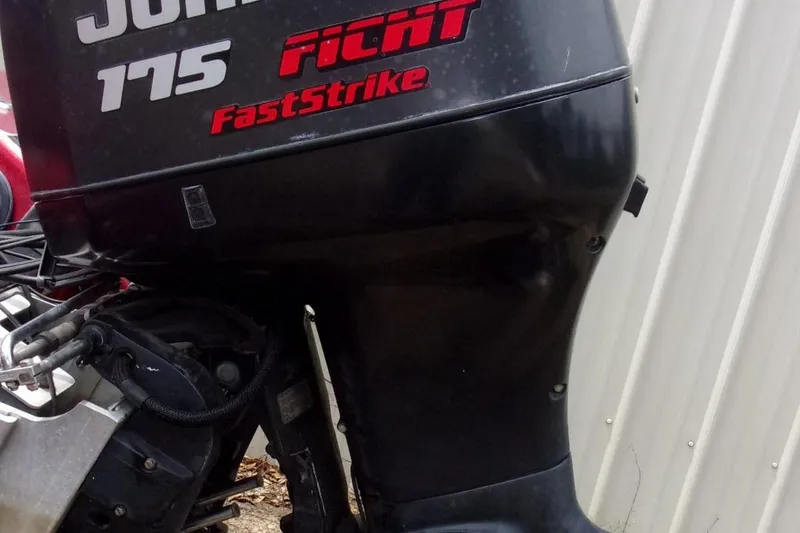 Slide: The Image of Outboard motor labeled "Johnson 175 FastStrike" on a 1996 Skeeter ZX200 boat. - 16