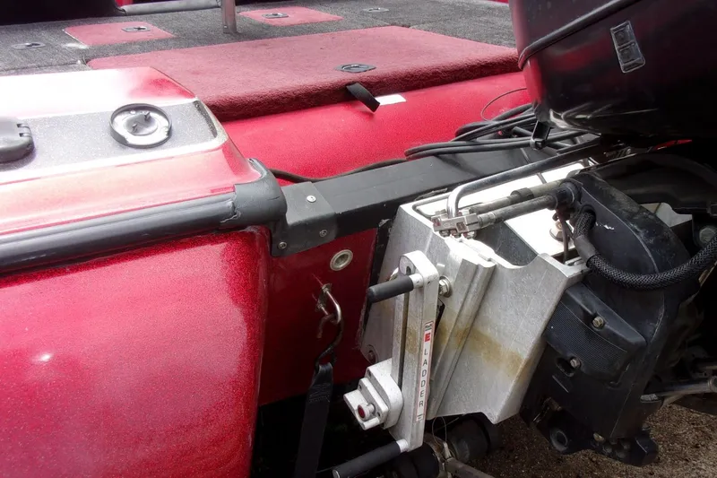 Slide: The Image of 1996 Skeeter ZX200 boat with red deck and motor details. - 3
