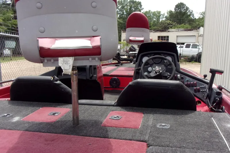 Slide: The Image of 1996 Skeeter ZX200 boat interior with steering wheel and seating. - 6
