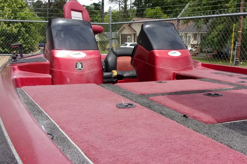 Slide: The Image of 1996 Skeeter ZX200 bass boat with red carpeted deck and dual consoles. - 8