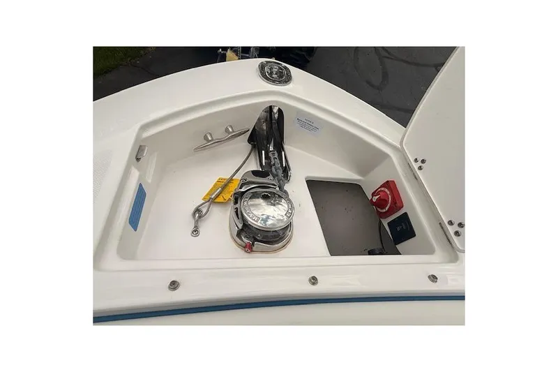 Slide: The Image of Anchor compartment of 2022 Regal LS6 Surf boat with winch and controls. - 16