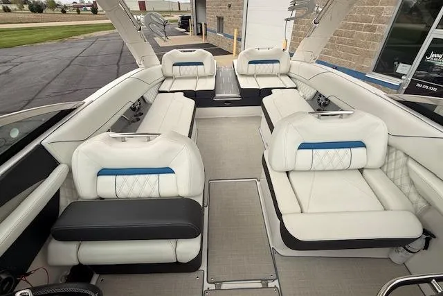 Slide: The Image of Luxurious interior of 2022 Regal LS6 Surf boat with white seating and modern design. - 19