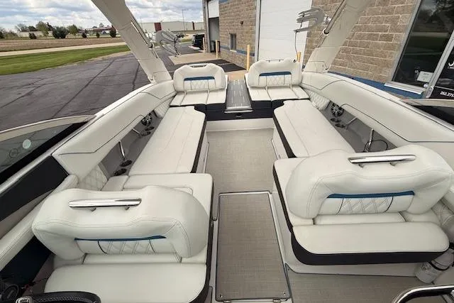 Slide: The Image of Luxurious interior of 2022 Regal LS6 Surf boat with spacious white seating. - 20