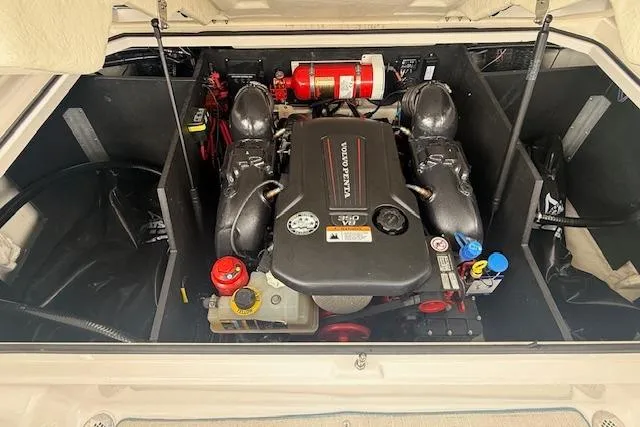 Slide: The Image of 2022 Regal LS6 Surf engine compartment with Volvo Penta motor and fire extinguisher. - 24