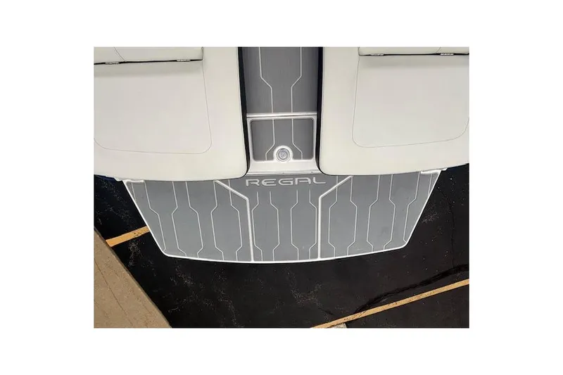 Slide: The Image of 2022 Regal LS6 Surf boat swim platform with sleek gray design and logo. - 29