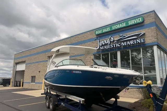 Slide: The Image of 2022 Regal LS6 Surf boat displayed at Jerry's Majestic Marine dealership. - 32