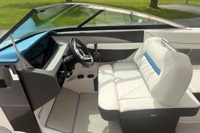Slide: The Image of 2022 Regal LS6 Surf boat interior with modern dashboard and comfortable seating. - 5