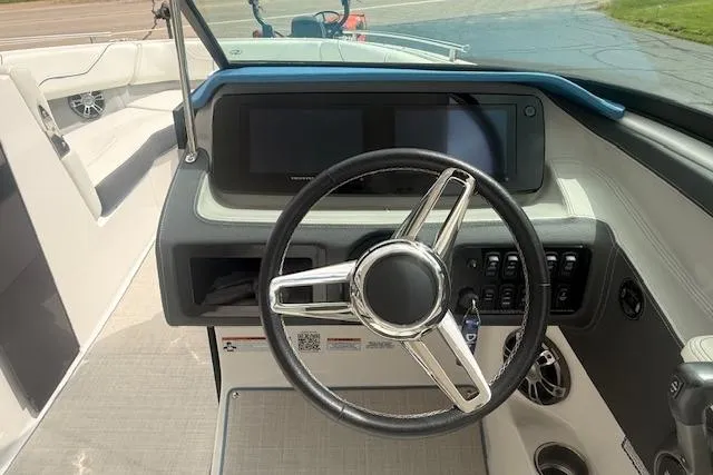 Slide: The Image of Steering wheel and dashboard of 2022 Regal LS6 Surf boat. - 6