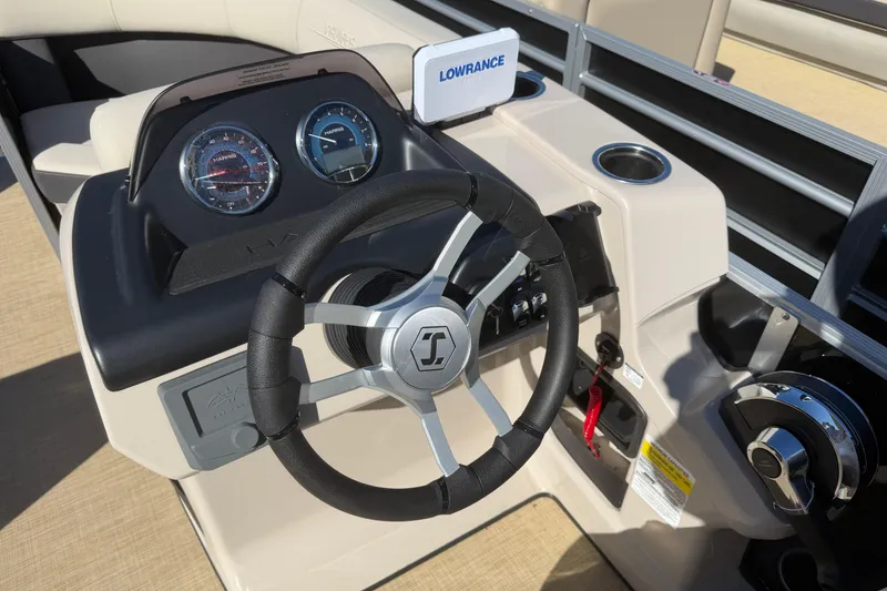 Slide: The Image of Steering console of 2026 Harris Cruiser 190 SL boat with gauges and Lowrance display. - 2