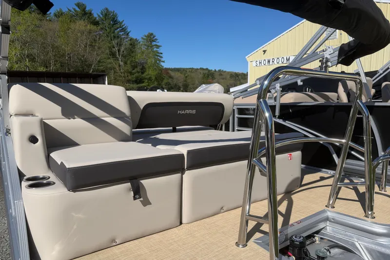 Slide: The Image of 2026 Harris Cruiser 190 SL boat interior with beige seating and stainless steel railings. - 5