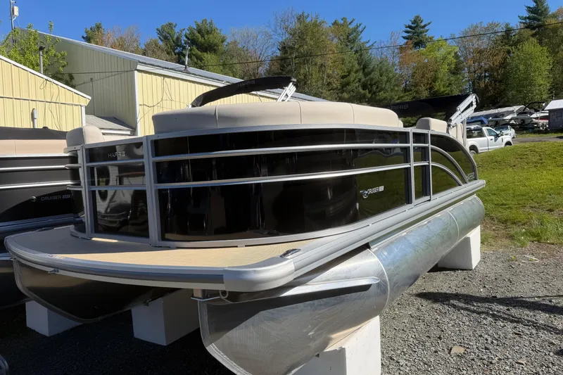 Slide: The Image of 2026 Harris Cruiser 190 SL pontoon boat displayed outdoors. - 8
