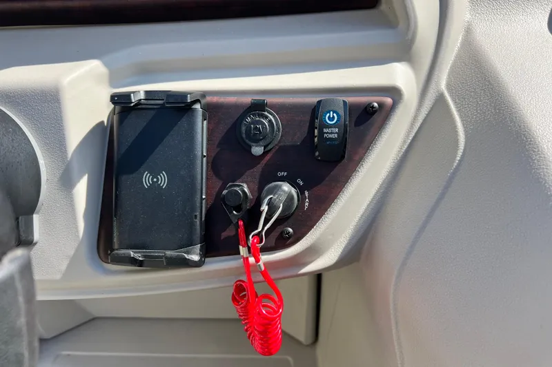 Slide: The Image of Control panel of 2023 South Bay 224 RS boat with power switch and key ignition. - 16