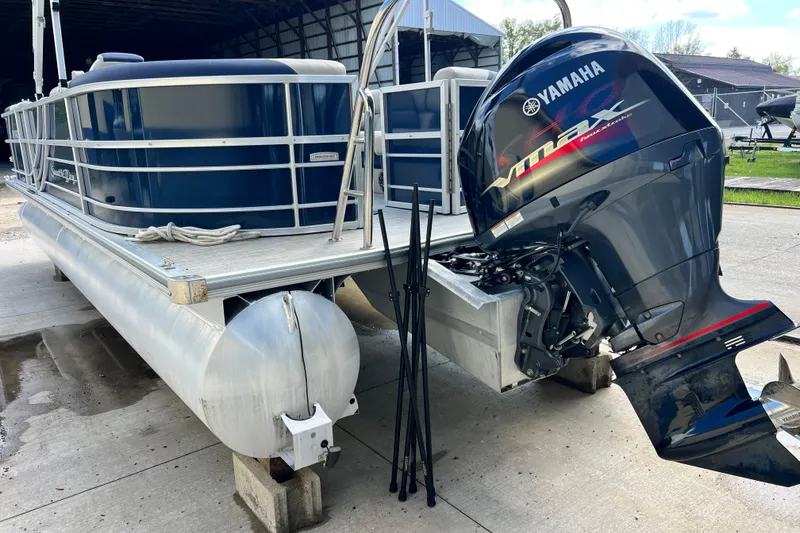 Slide: The Image of 2023 South Bay 224 RS pontoon boat with Yamaha VMAX outboard motor. - 2