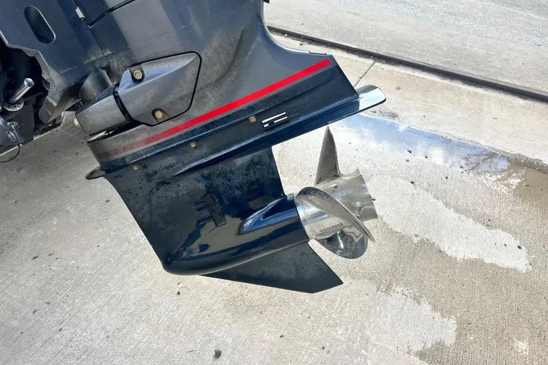 Slide: The Image of Close-up of a 2023 South Bay 224 RS boat motor and propeller on concrete. - 7