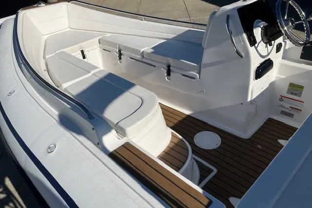 Slide: The Image of 2013 AB Inflatables Nautilus 17 boat interior with white seating and wooden flooring. - 3
