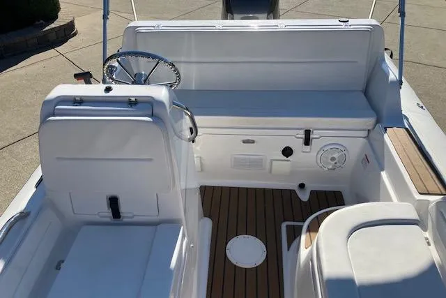 Slide: The Image of 2013 AB Inflatables Nautilus 17 boat interior with steering wheel and seating. - 4