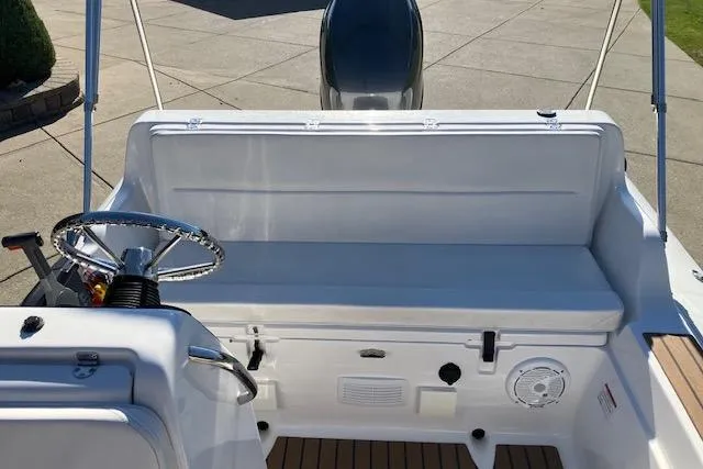 Slide: The Image of 2013 AB Inflatables Nautilus 17 boat interior with steering wheel and seating area. - 5