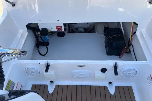Slide: The Image of 2013 AB Inflatables Nautilus 17 boat interior showing storage compartment and electrical components. - 6