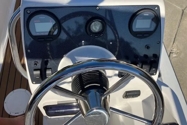 Slide: The Image of Steering wheel and dashboard of 2013 AB Inflatables Nautilus 17 boat. - 8