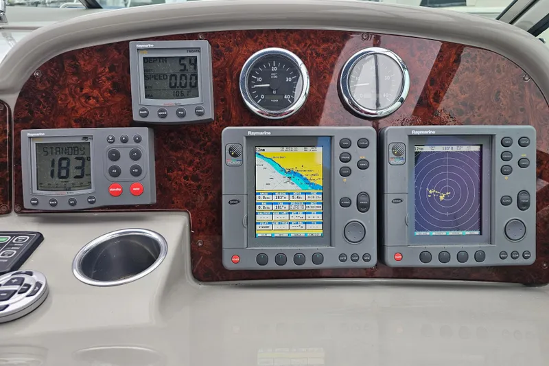 Slide: The Image of Dashboard of a 2003 Formula 41 Performance Cruiser with navigation and radar displays. - 11