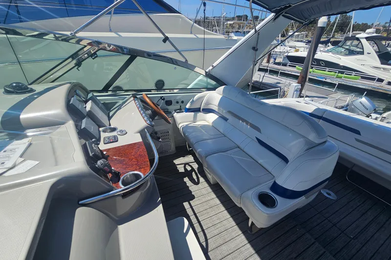 Slide: The Image of 2003 Formula 41 Performance Cruiser cockpit with white seating and control panel. - 12