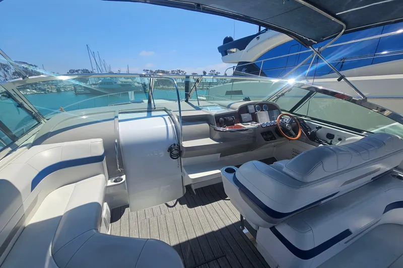 Slide: The Image of 2003 Formula 41 Performance Cruiser cockpit with luxurious seating and modern dashboard. - 14