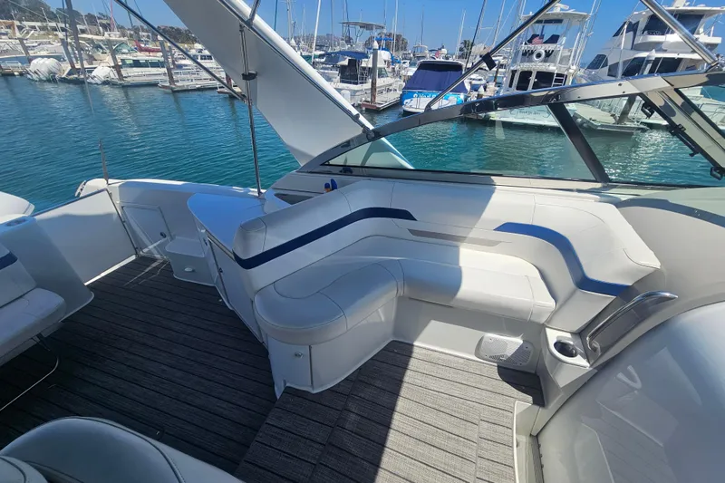 Slide: The Image of 2003 Formula 41 Performance Cruiser interior with white seating, docked at marina. - 19