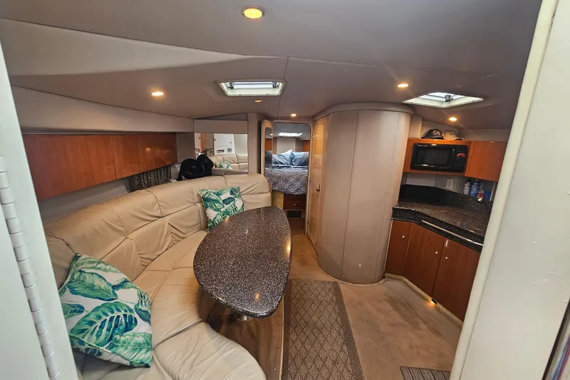 Slide: The Image of Interior of 2003 Formula 41 Performance Cruiser with cozy seating and modern kitchen amenities. - 21