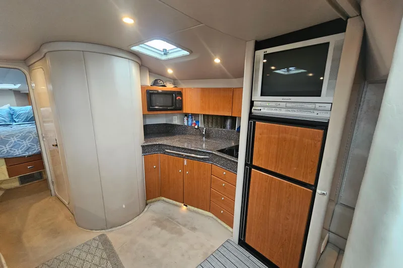 Slide: The Image of Interior of 2003 Formula 41 Performance Cruiser with kitchenette and entertainment system. - 24