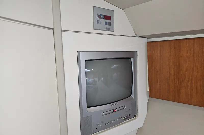 Slide: The Image of 2003 Formula 41 Performance Cruiser interior with built-in vintage TV. - 30