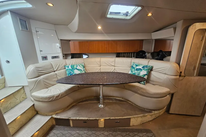 Slide: The Image of Luxurious interior of a 2003 Formula 41 Performance Cruiser with plush seating and elegant table. - 33