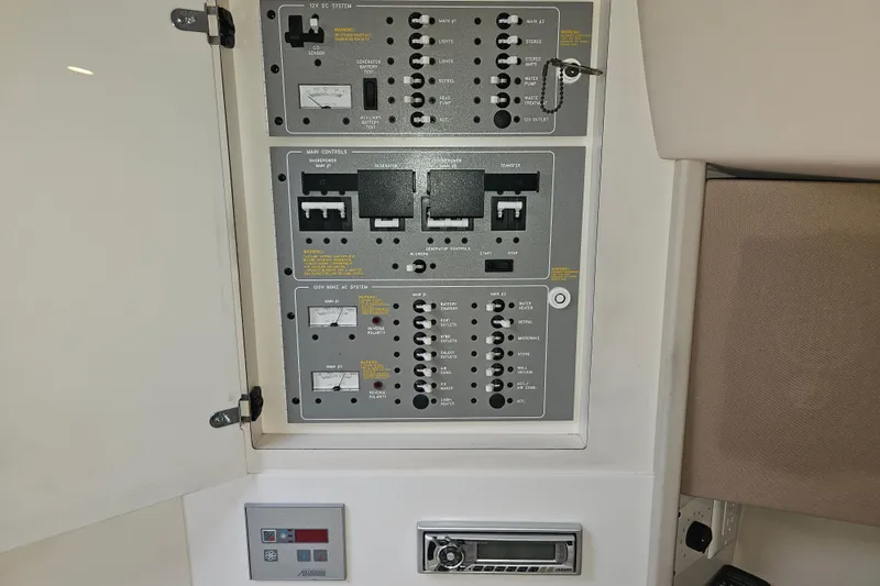 Slide: The Image of Electrical control panel on a 2003 Formula 41 Performance Cruiser boat. - 36