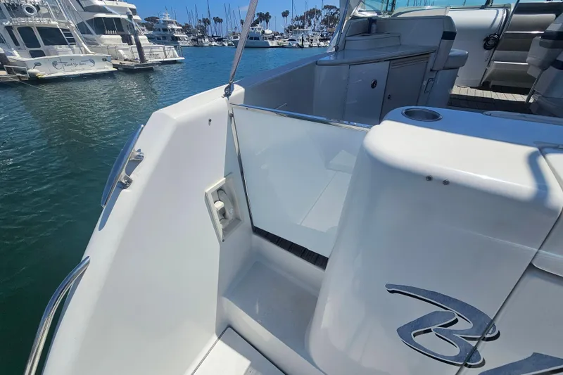 Slide: The Image of 2003 Formula 41 Performance Cruiser docked in marina, showcasing sleek design and spacious deck. - 8